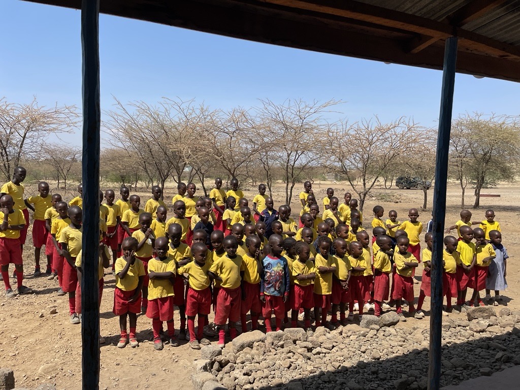 Schoolchildren assembling outside Ilparakou School